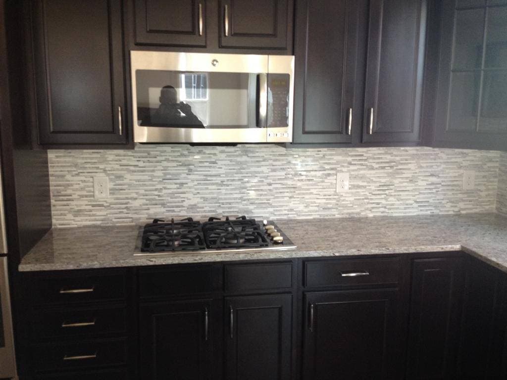 picture of newly remodeled kitchen with gray and white custom tile